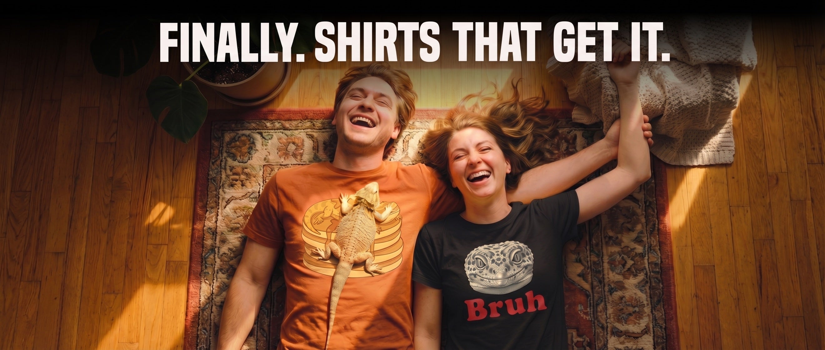Two friends laughing on a rug wearing Basking Club reptile t-shirts, with a bearded dragon perched on one shirt